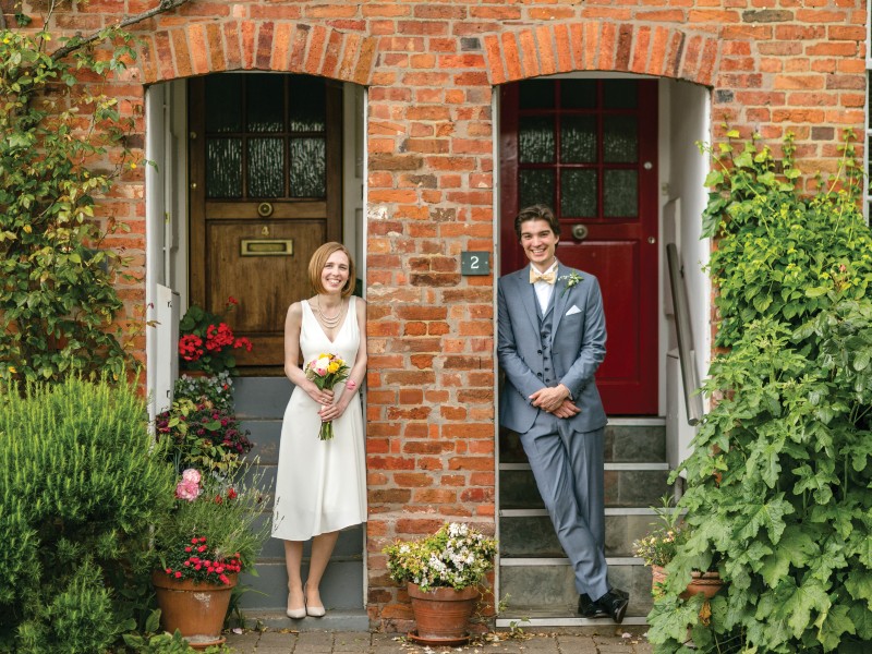 Married couple stood outside separate doors